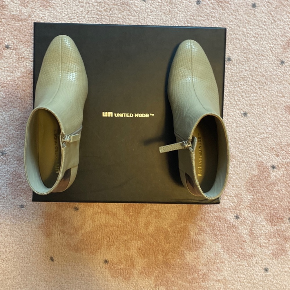 United nude tan coloured high heeled boot with zipper